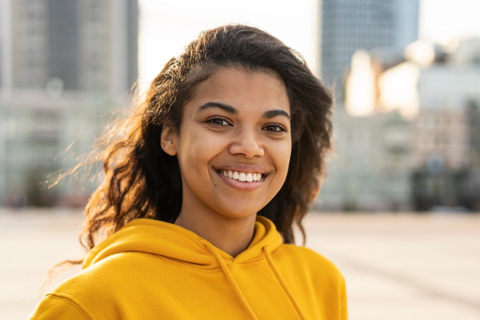 front view beautiful girl with yellow hoodie